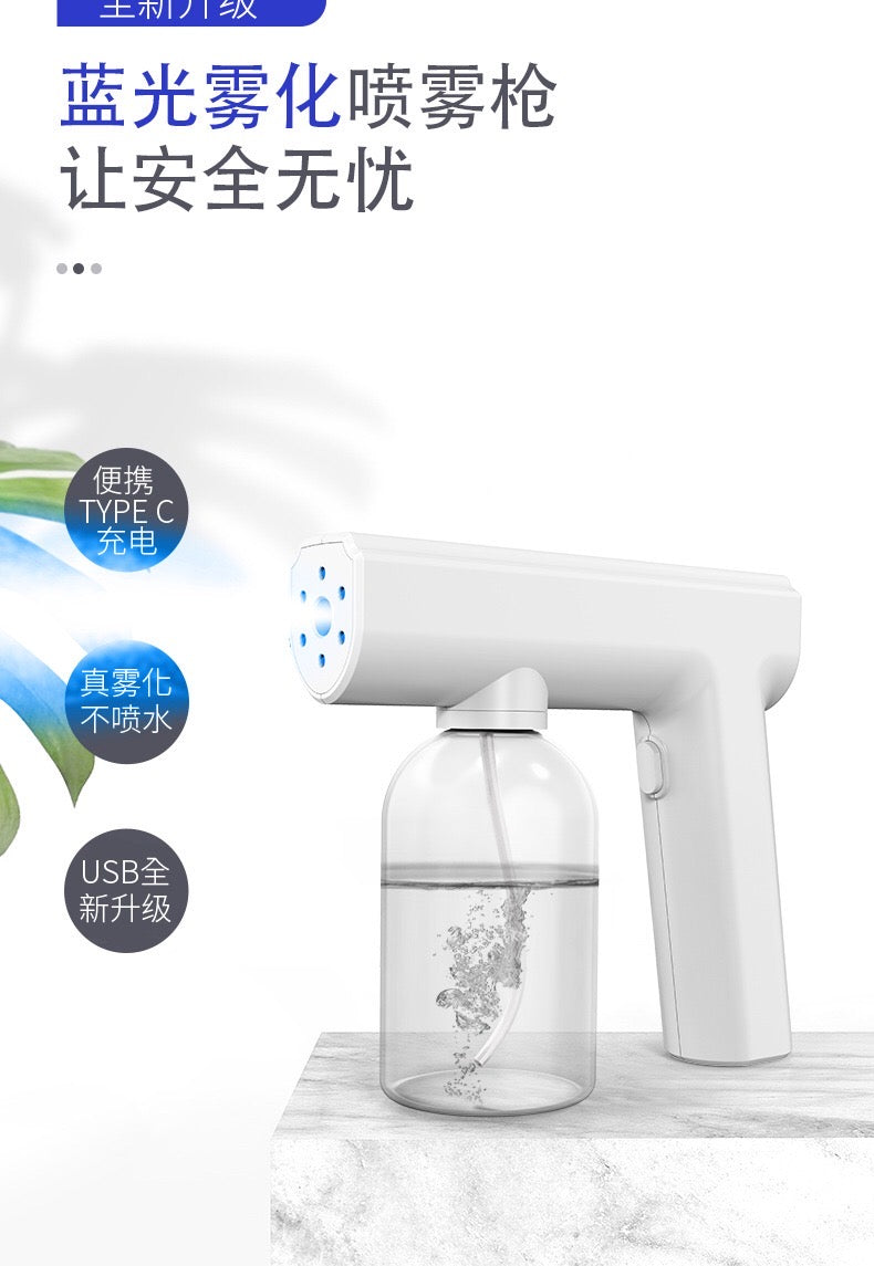 Neue kabellose Zerstäubungs-Desinfektionspistole, wiederaufladbarer Nano-Spray, elektronischer Haushalts-Zerstäuber mit blauem Licht